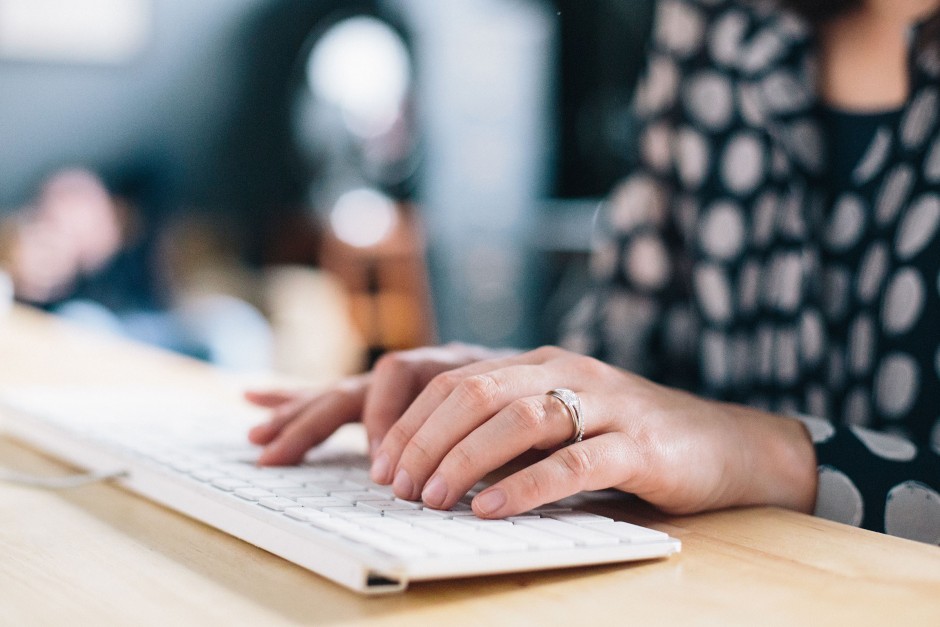 Woman typing on keyboard