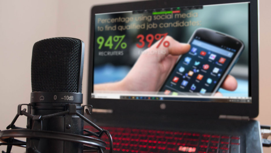 Photo of laptop with mic in foreground