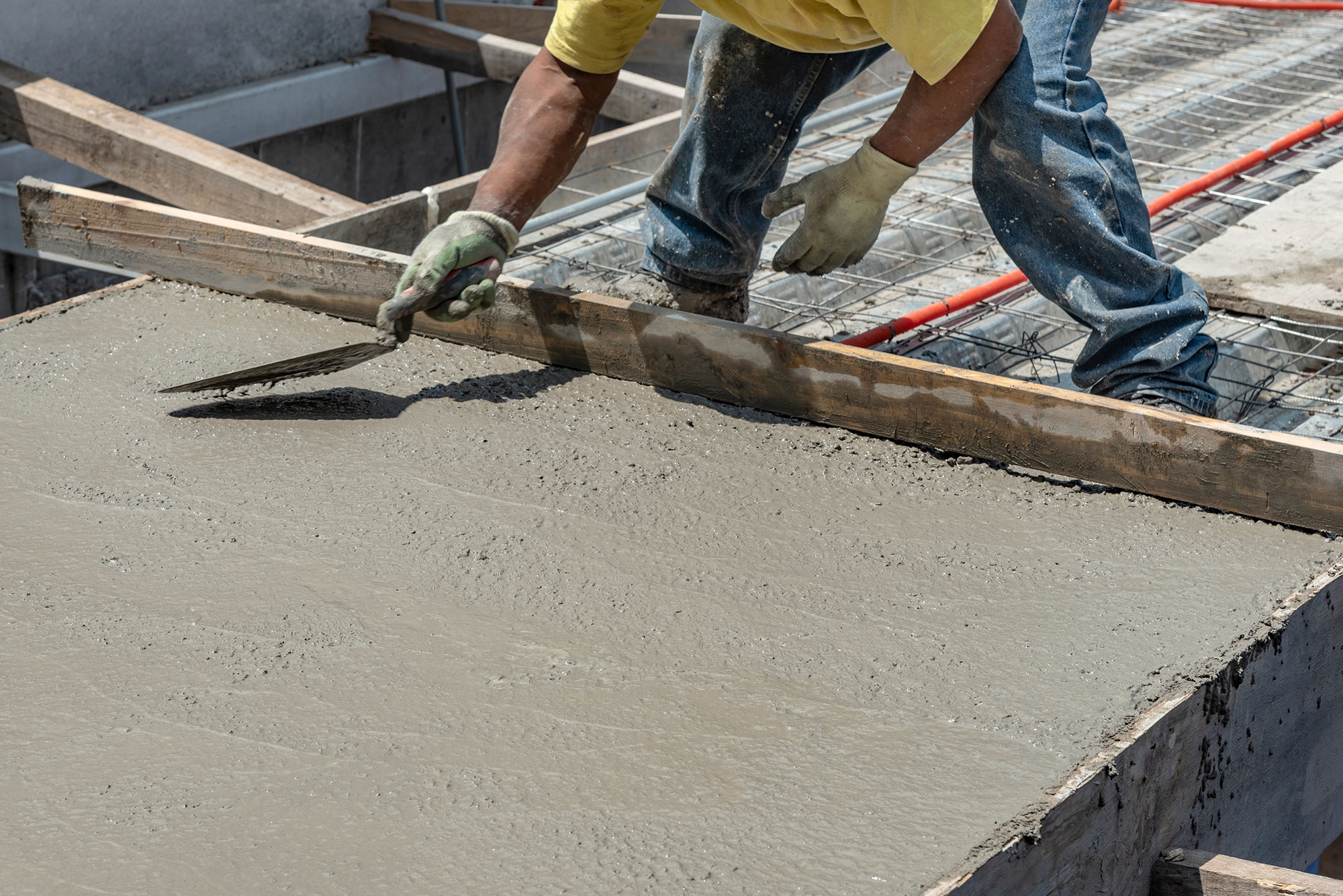 Man smoothing cement