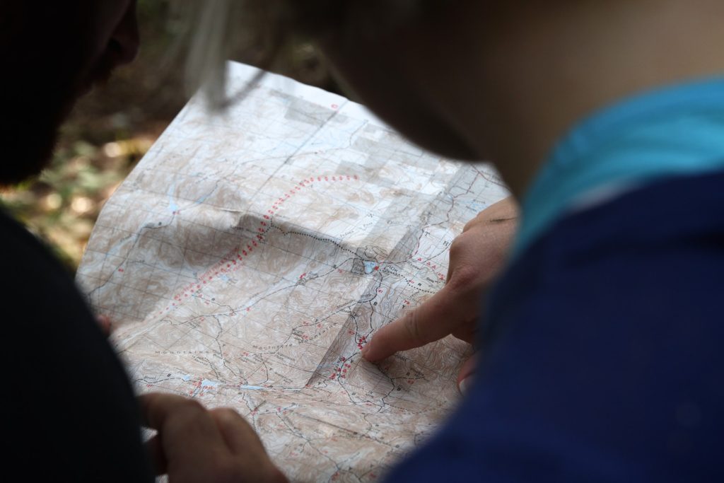 Photo of hikers consulting a map