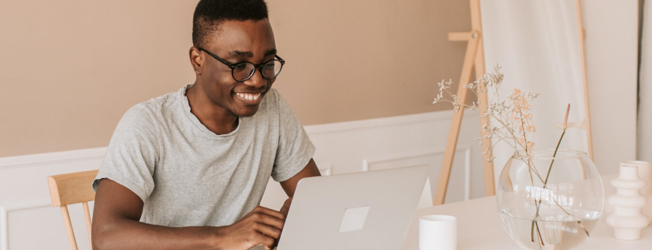 Happy man at laptop