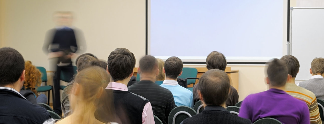 Photo of a man teaching an in-person class